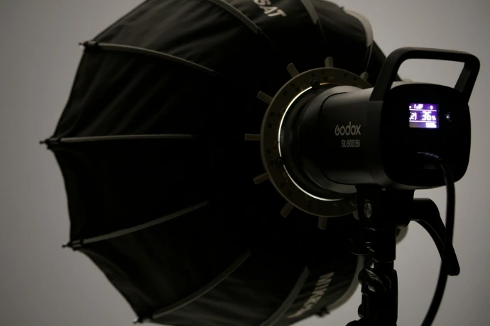 A professional photography light with a softbox.